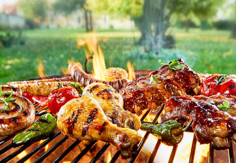 Assorted of mixed meats on a BBQ grill