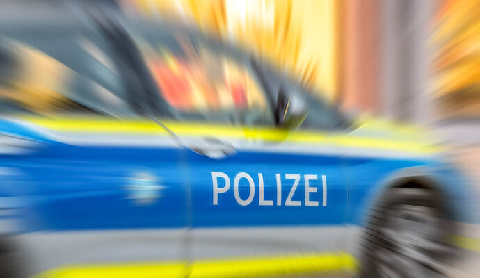 Motion blur of German police car with letters POLIZEI.