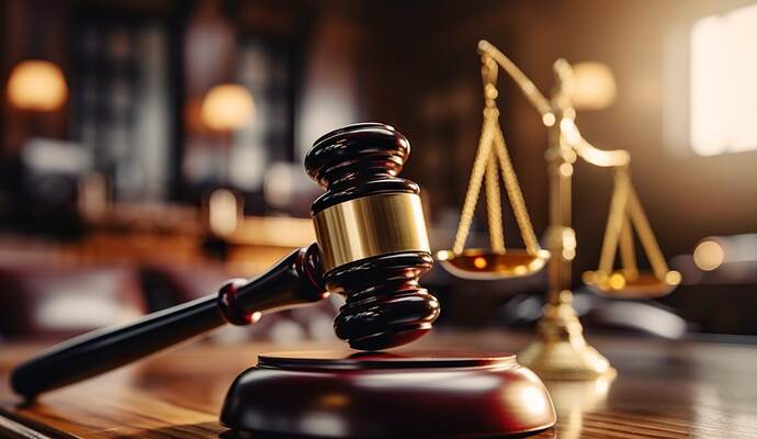 Close-up of gavel on judge desk, symbolizing court trial, justice and legal decisions in courtroom