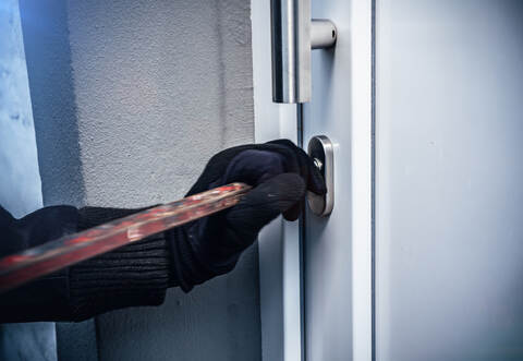 masked burglars breaking and entering into a victim's home 