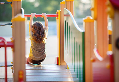 Little kid on playground, children's slide