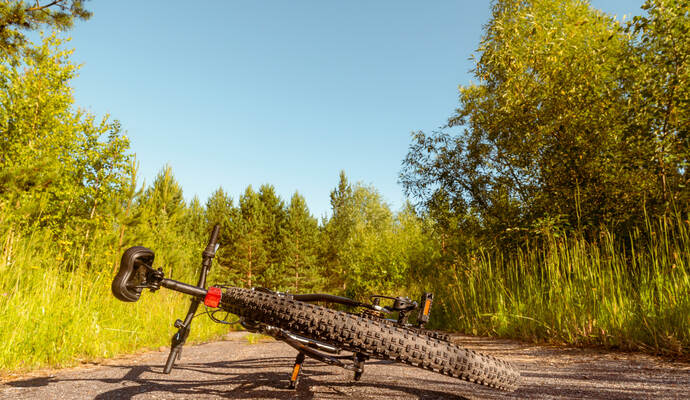 Bicycle lies on rural road
