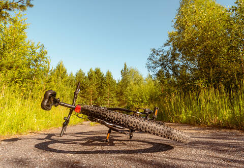 Bicycle lies on rural road