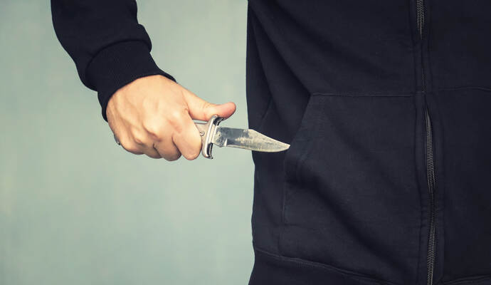 A maniac with a knife in his pocket. The murderer hides a small folding knife. Intimidation with a knife in the robbery. mafia