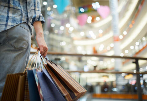 Holding many shopping bags