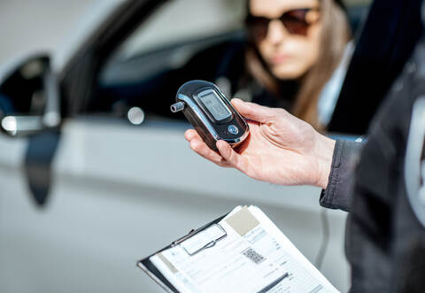 Policeman with alcotest device