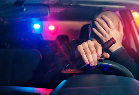 Sad man is caught driving under alcohol influence