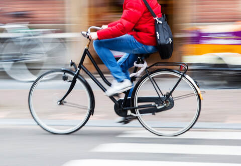 bicycle rider in the city in motion blur