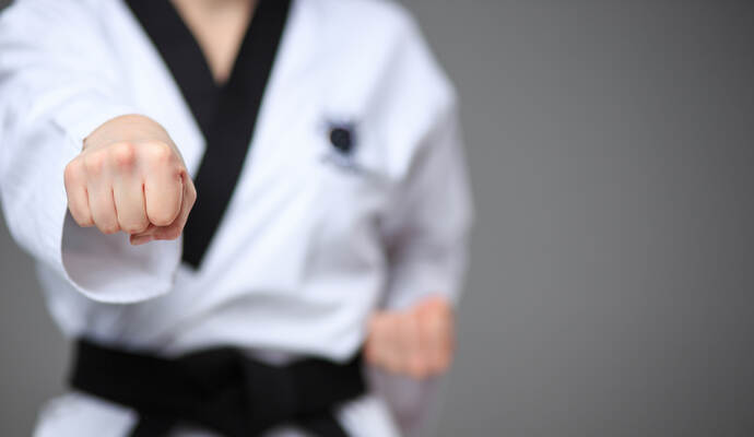 The karate girl with black belt 
