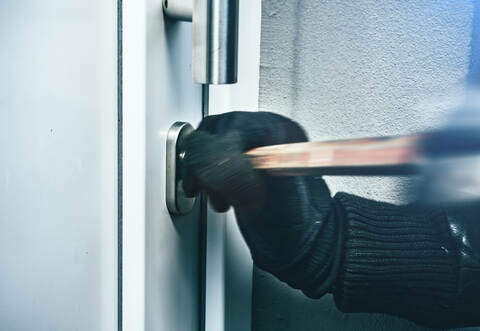 masked burglars breaking and entering into a victim's home
