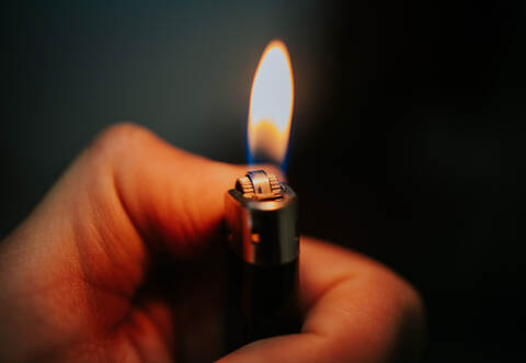Lighter in the persons hand