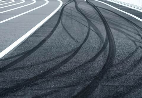 Abstract texture surface and background of car tire drift skid mark on road race track, Black tire mark on street race track, Au