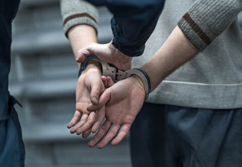 handcuffing the arrested person. Implementation of the arrest