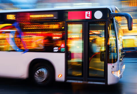 driving bus in the city at night